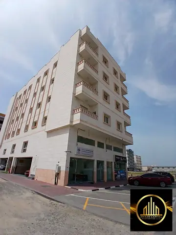 A one-and-a-half-year-old mixed-use residential and commercial building for sale in Al-Jarf 3, behi