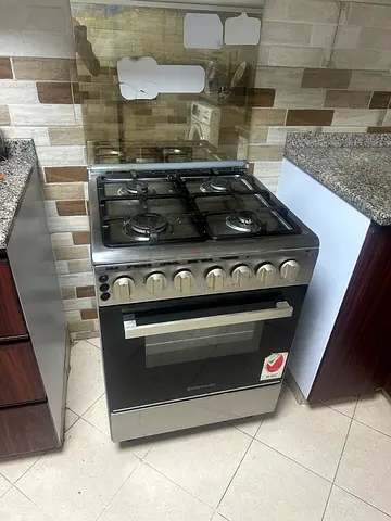 freestanding gas stove with oven - ver good working condition, not even having single scratch..
