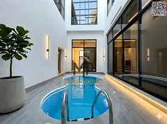 Two-story corner villa with a private pool and rooftop terrace. Spacious villa with a palatial desig