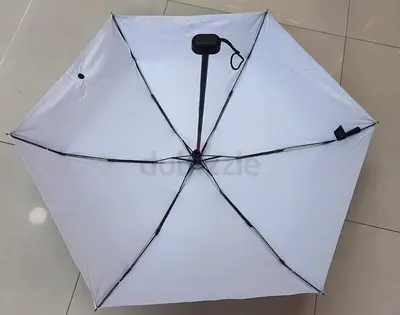 Compact Black umbrella inside white — foldable, gently used