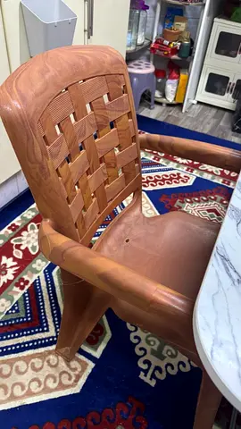 Brown Plastic Chair with Woven Back Design
