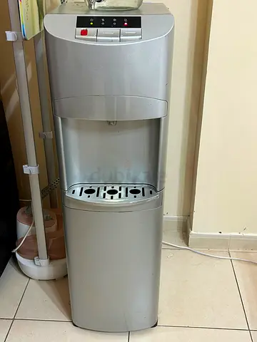 Silver freestanding water dispenser - working, good condition 2 numbers outside bottle and inside bo