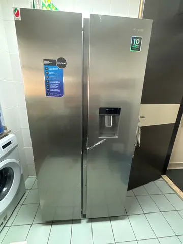 Stainless Steel Side-by-Side Refrigerator with Ice Dispenser - Excellent Condition