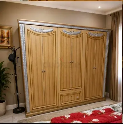 Selling a complete, matching luxury wooden bedroom set with elegant silver accents.
