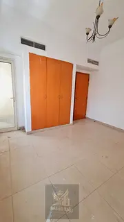 One-bedroom apartment with a living room in Sharjah, featuring free maintenance, central air conditi