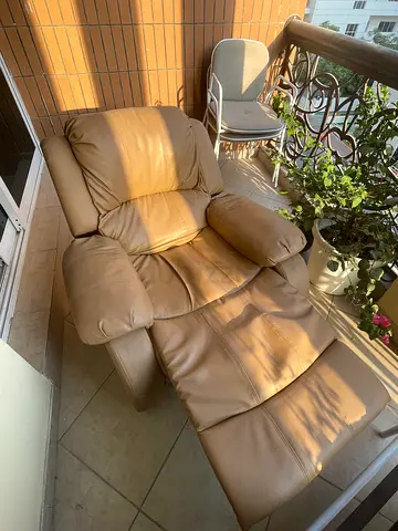 Beige leather recliner armchair - comfortable, good condition