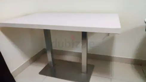 Small white console table with metal pedestal legs
