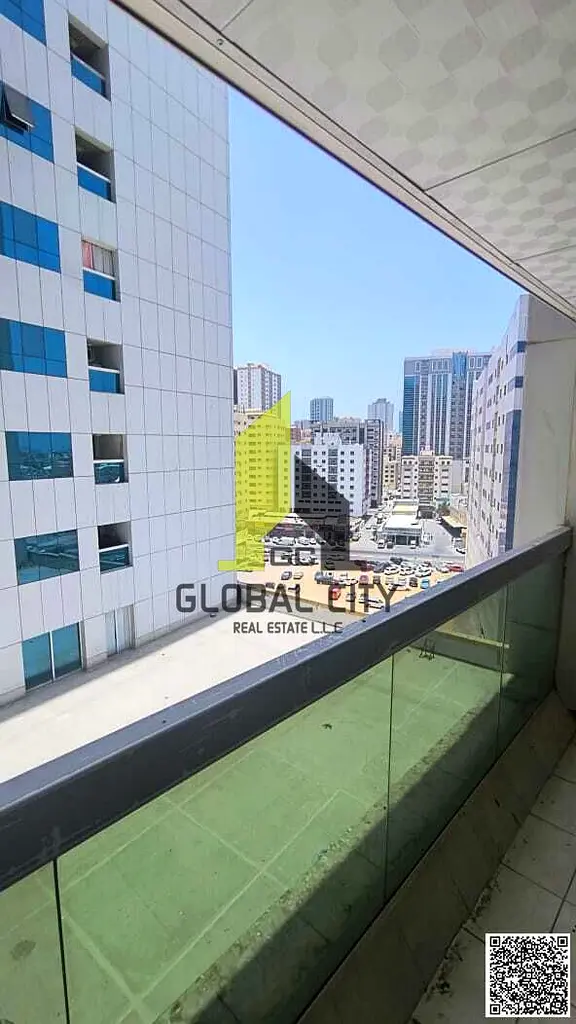Live in Pearl Towers | Family-Friendly 1BHK with Separate Kitchen & Open Side View | Private Parking | Easy Access to Dubai | AED 31,000 Only
