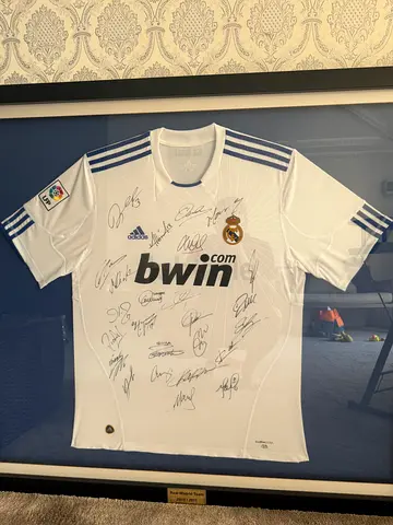 Framed Real Madrid 2010/2011 Team Signed Jersey