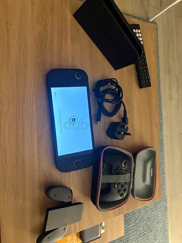 Nintendo Switch with Carrying case, pro controller, EA FC26 And Mariokart World