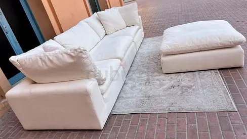 Modular feather filled sofa with footstool