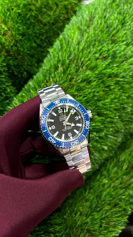 Omega Mens stainless steel automatic watch with blue bezel