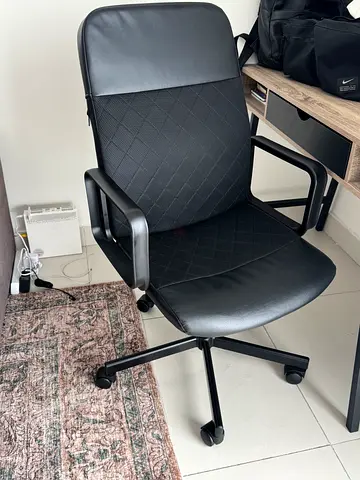Black swivel office chair with armrests - good condition
