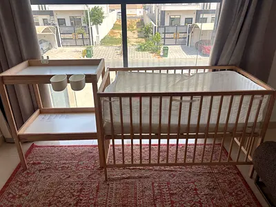 IKEA wooden crib with matching changing table - good condition