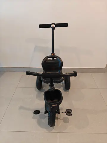 Black toddler tricycle with parent push handle - good condition
