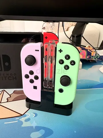Nintendo Switch console with pastel neon Joy‑Con controllers (excellent condition)