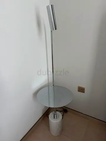 Modern chrome floor lamp with built-in side table and marble base