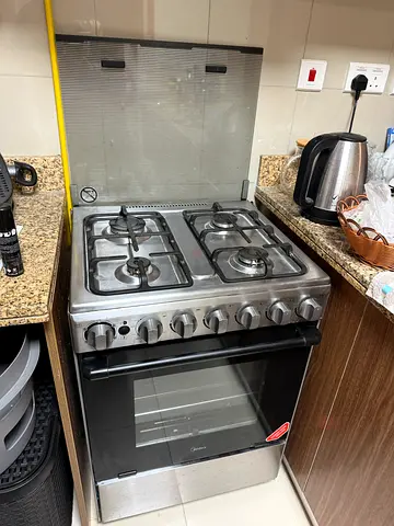 Stainless Steel 4-Burner Gas Cooker with Oven - Good Working Condition