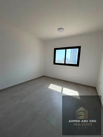 A stunning 2-bedroom apartment with a living room available for annual rent in Al Jurf 3. It featur