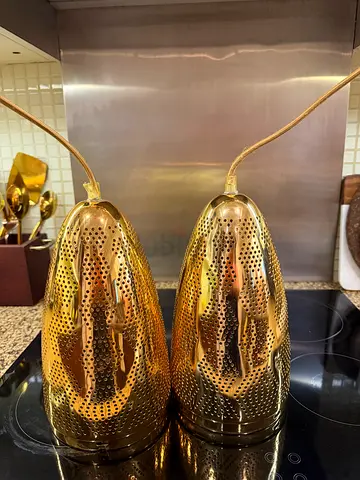 Pair of decorative perforated brass pendant lights - used