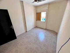 One bedroom and living room, balcony, central air conditioning, easy access to Sharjah and Dubai.
