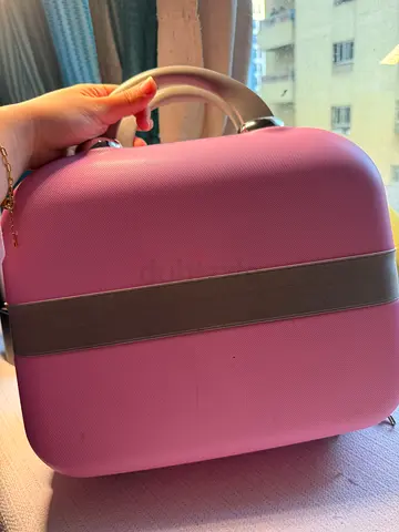 Small hard-shell pink luggage carry-on case with handle - for vanity / cosmetics / accessories