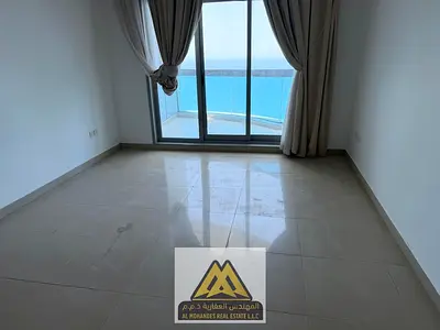 For annual rent: Two-bedroom apartment with a living room in Corniche Tower, featuring a full sea v