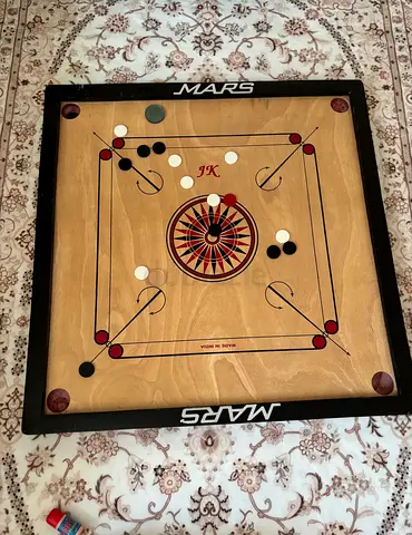 Carrom board with carrom powder