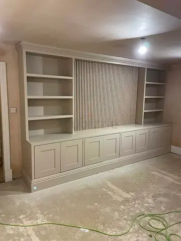 Custom built-in wall unit with shelves and cabinets
