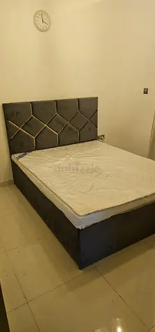 Queen size upholstered storage bed with headboard - good condition