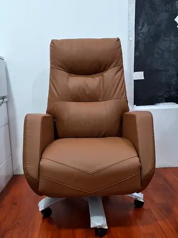 Brown leather swivel office chair with high back