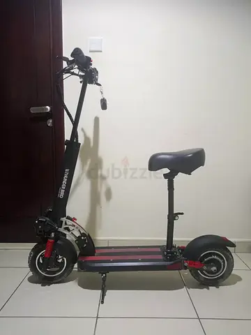 Electric off-road scooter with front suspension and dual headlights