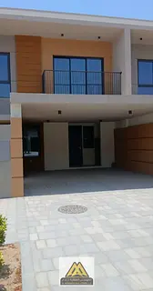 4-bedroom townhouse villa with a large area, located in the Azha community, near all services and ma