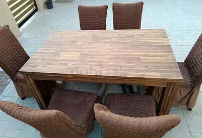 Solid wood table with 6 brown covered chairs