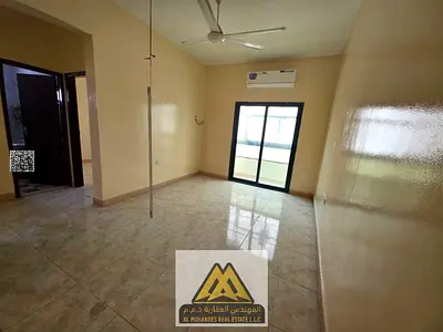 2 bedroom hall in Al Rawda 2, Ajman, 2 bathrooms, balcony, split AC, AED 30k, 4 payments, prime location.