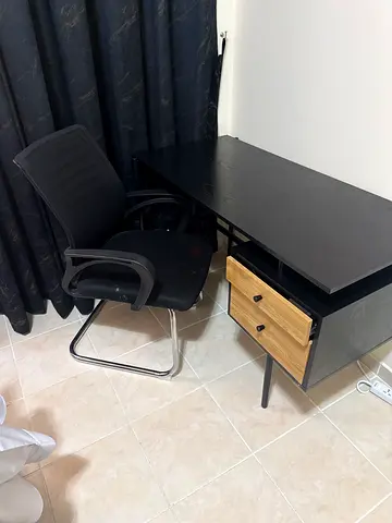 Black office desk with two-drawer pedestal and chair - good condition