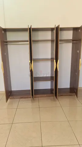 Three-piece wooden wardrobe with shelves and hanging rails - good condition
