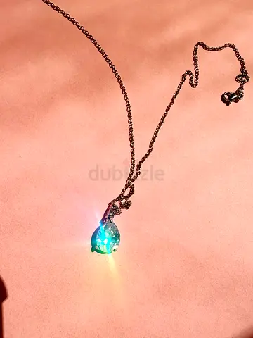 Silver-tone necklace with pear-shaped crystal pendant