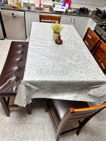 Dining table with 4 chairs and one big chair