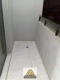 A spacious one-bedroom apartment with a balcony in Al Muwaihat 2, Sheikh Ammar Street, near Nesto su