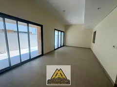 Luxury townhouse within a prestigious residential community, featuring a modern design and spacious