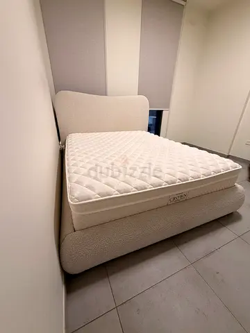 Queen upholstered bed frame with mattress - barely used, neutral beige