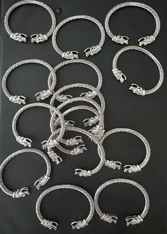 Collection of 15 stainless steel Twisted Dragon Cuff Bracelets