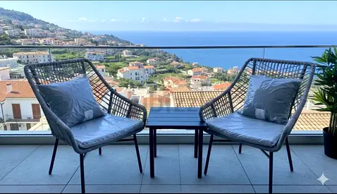 Outdoor balcony bistro set — 2 woven chairs with cushions + side table
