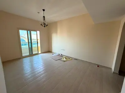 One bedroom and living room for annual rent in Muwailih Commercial Area, with a master bedroom and balcony, 2 bathrooms, and parking, near Muwailih Pa