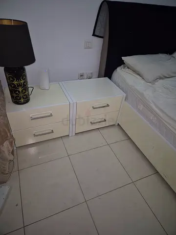 White bedside table / nightstand with 2 drawers - good condition. Can give along with the bed 500aed