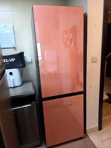 Samsung Bespoke bottom freezer refrigerator featuring customizable pink glass panels