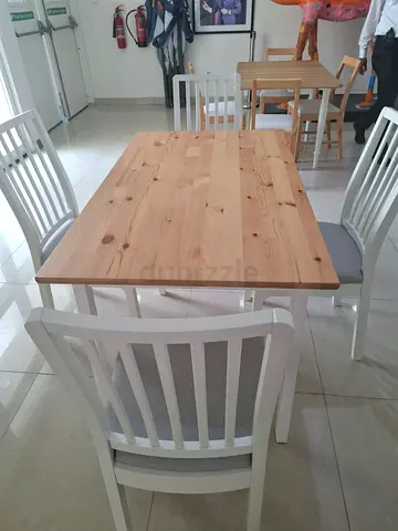 Wooden dining table with 4 white chairs - good condition
