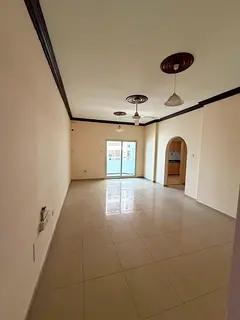 Annual Rent | Al Qasimia – Sharjah Spacious two-bedroom apartment with a living room, balcony, and