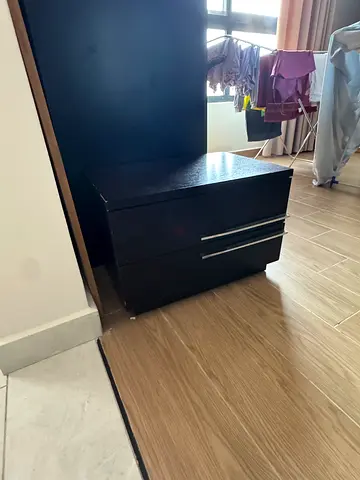 Dark brown bed set with wardrobe and bedside tables with a dresser
